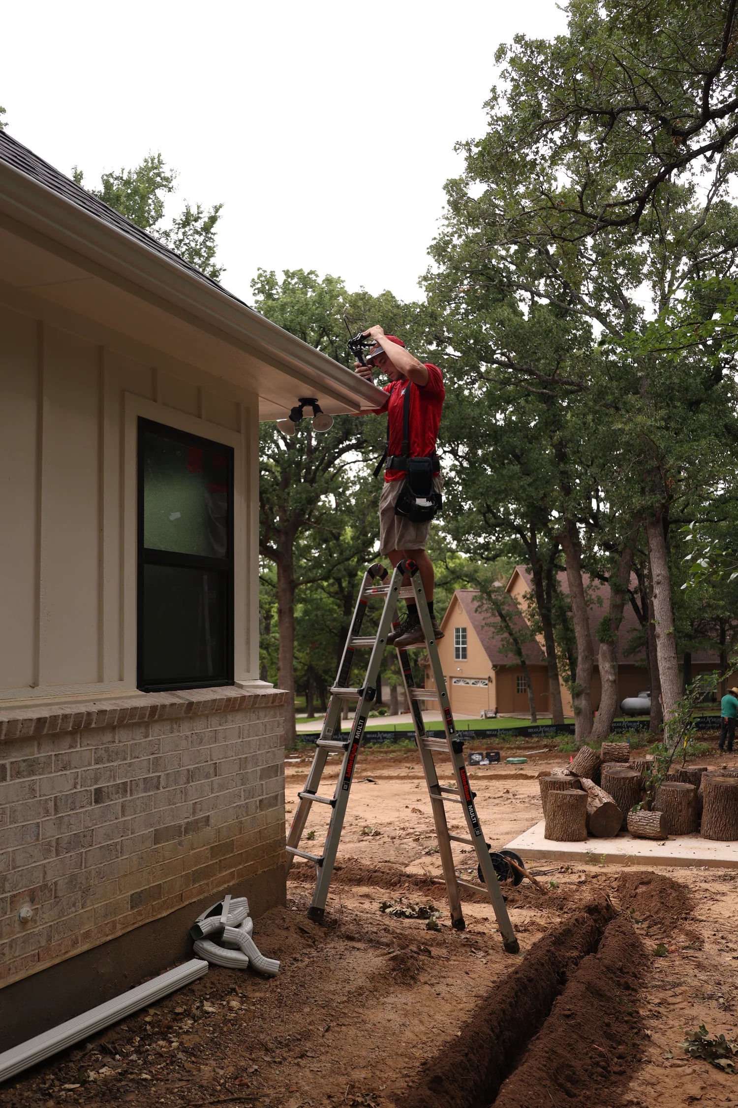 North Texas Gutters crew working on an Arlington gutter project