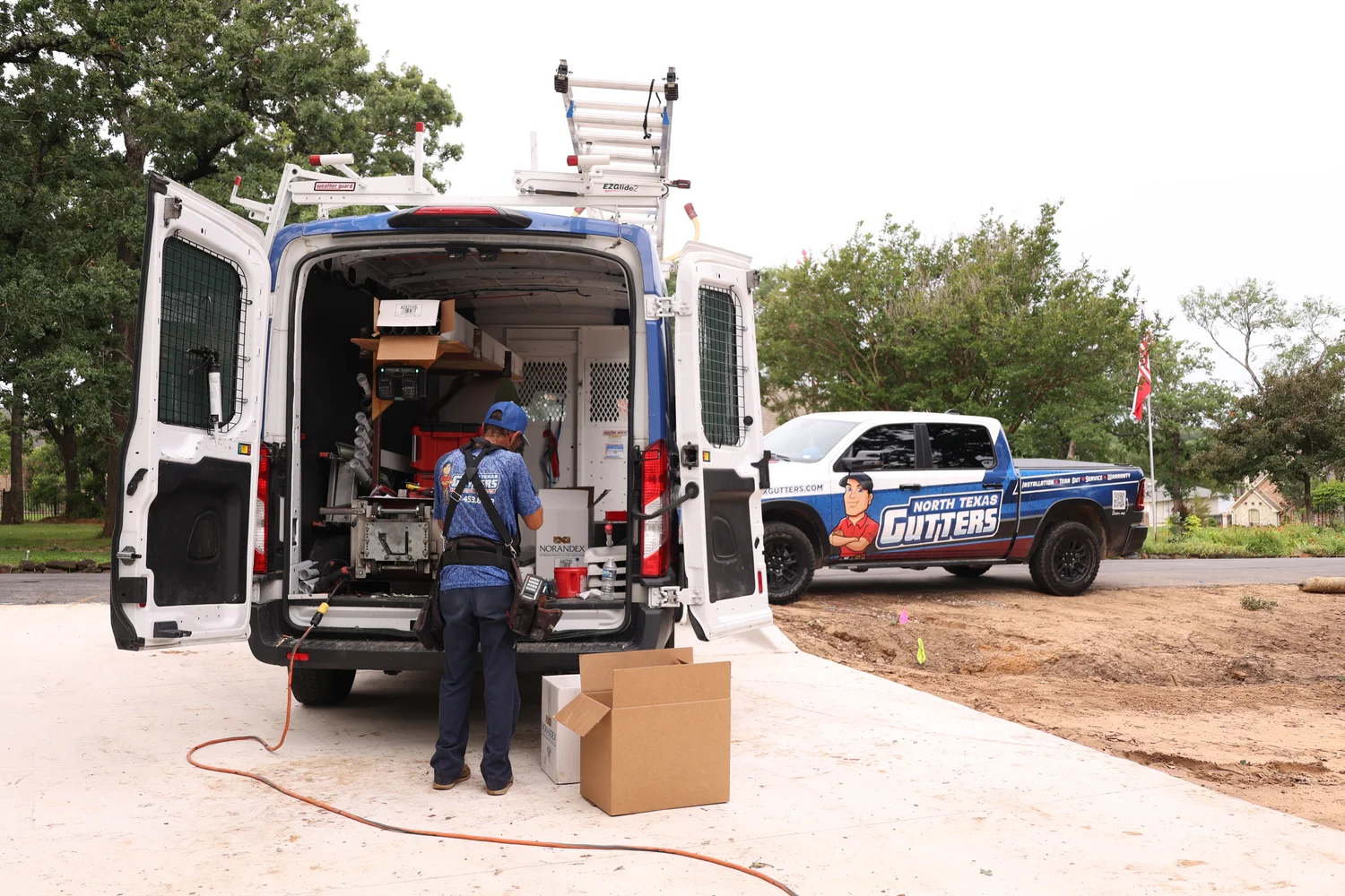 North Texas Gutters crew on a gutter install in Bedford