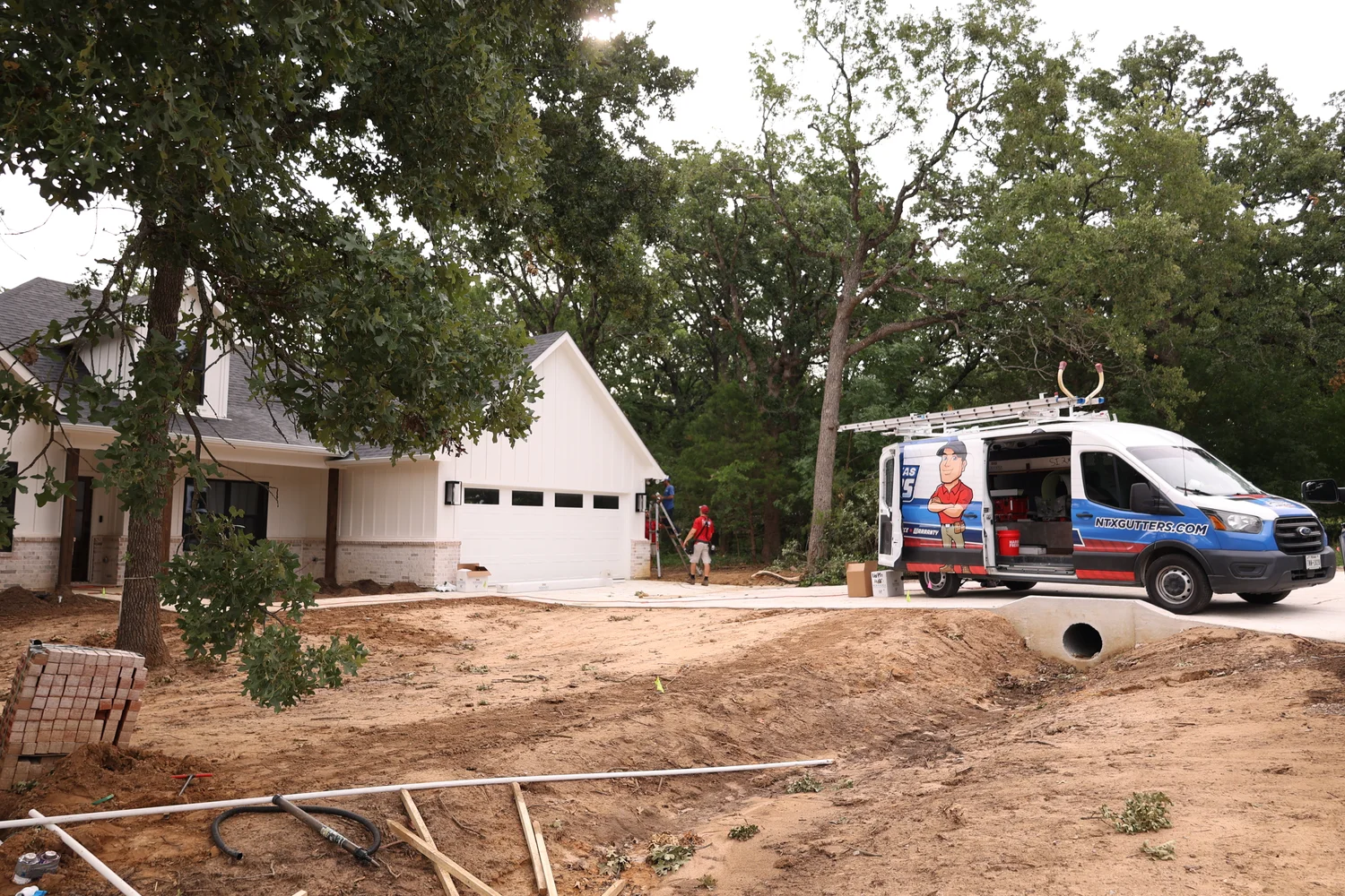 North Texas Gutters crew working on a Frisco gutter project