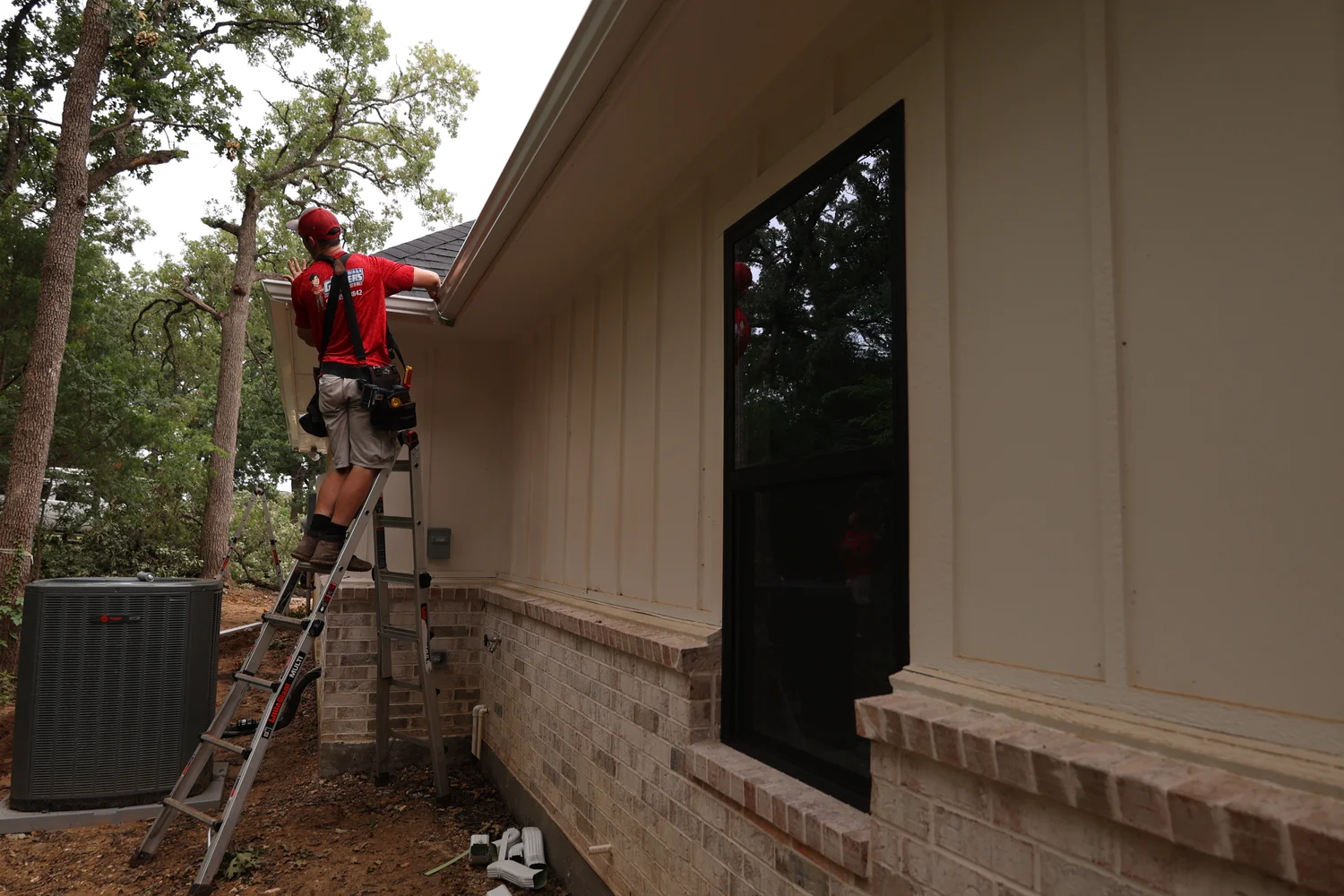 North Texas Gutters crew working on a Garland gutter project