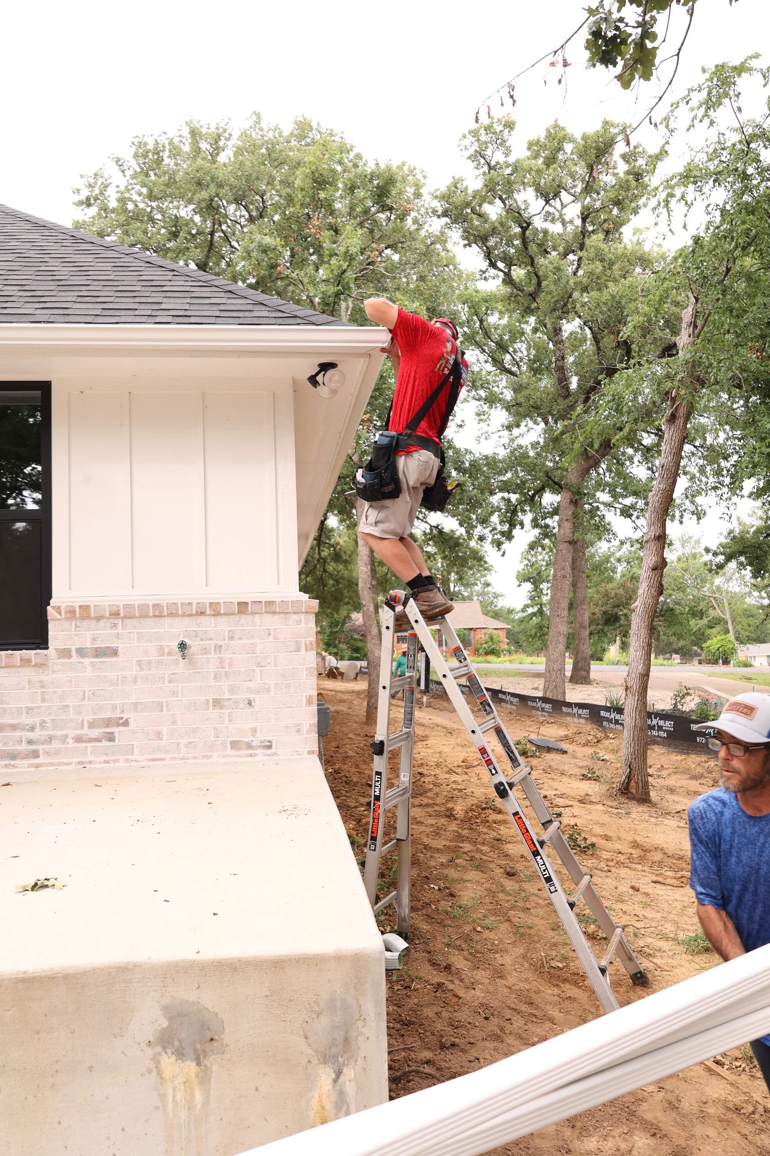North Texas Gutters crew working on an Irving gutter project