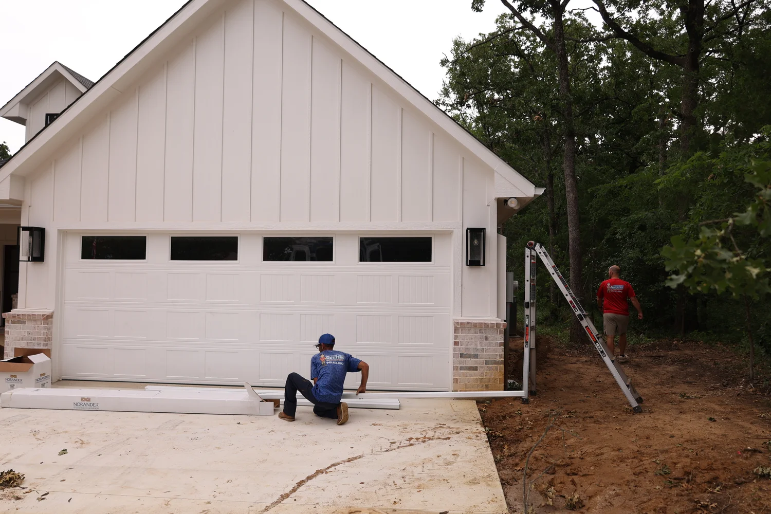 North Texas Gutters crew working on a Lake Lewisville-area gutter project