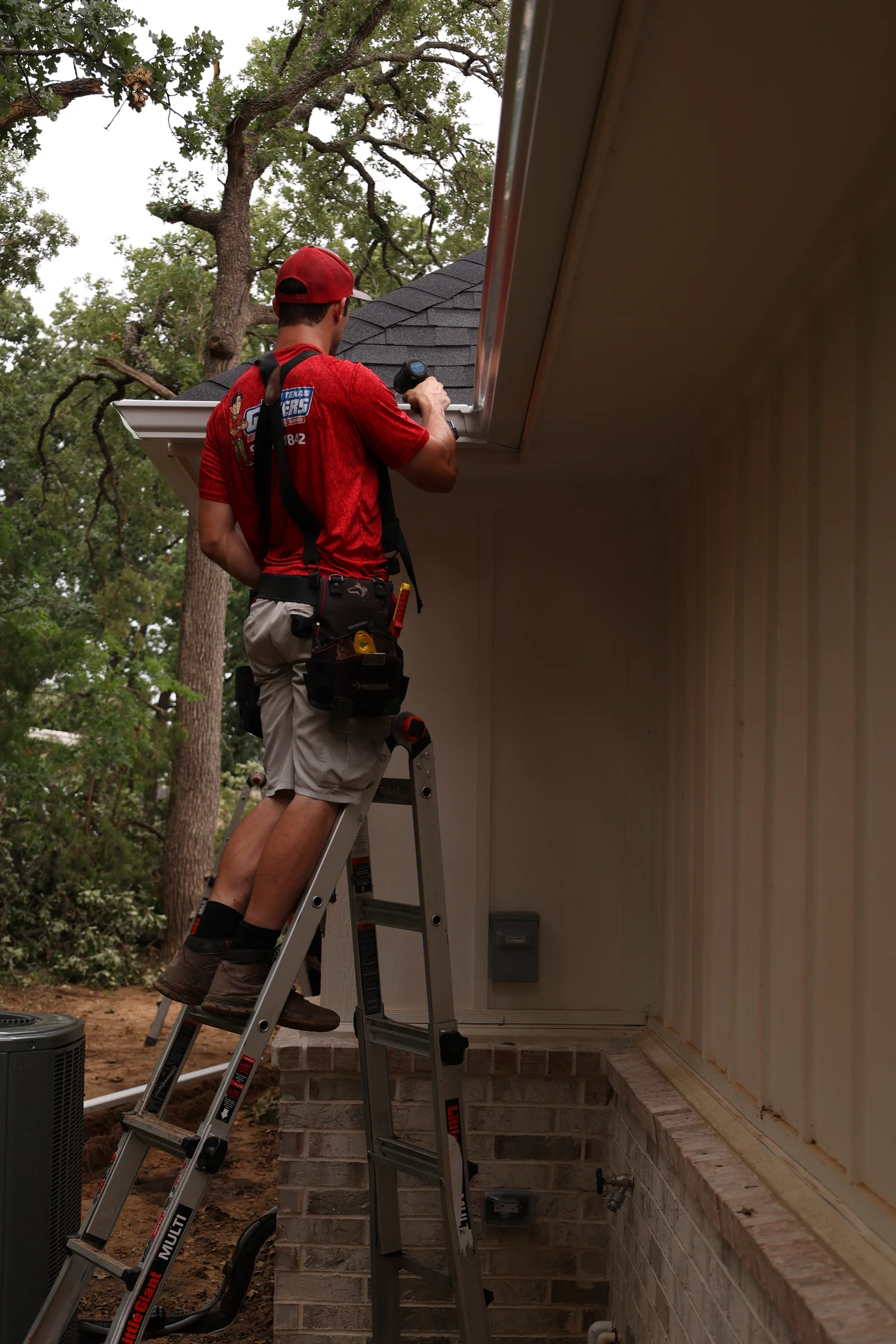 North Texas Gutters crew working on a Mansfield gutter project