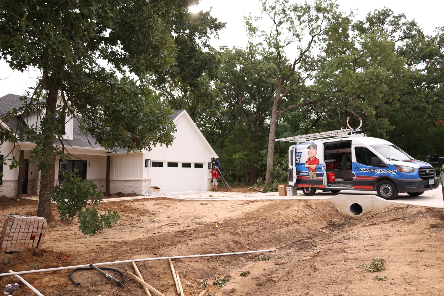 North Texas Gutters crew working on a McKinney gutter project
