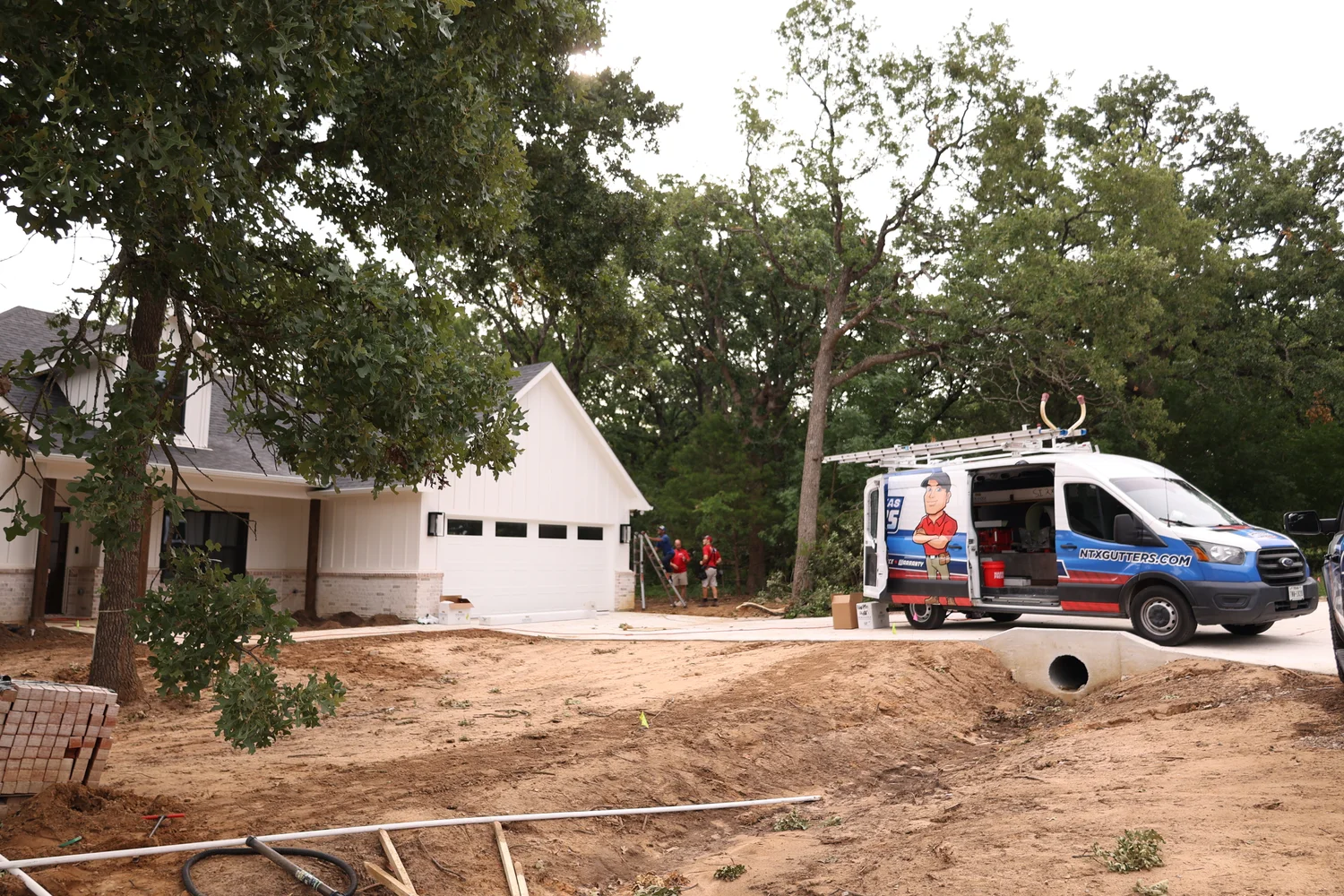 North Texas Gutters crew working on a Plano gutter project