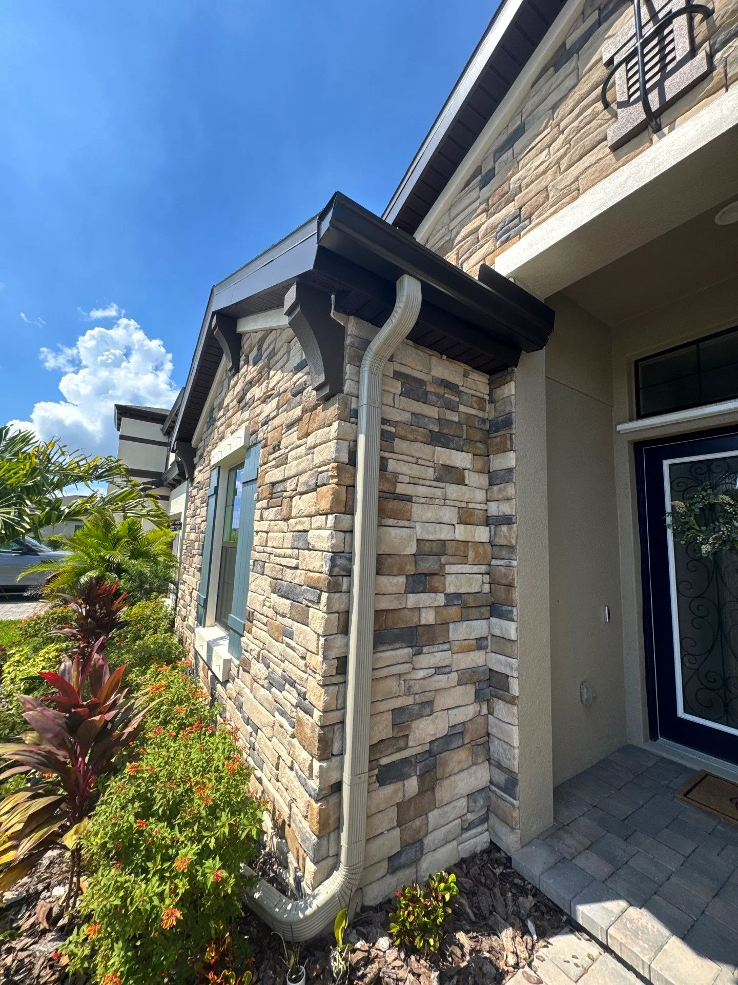 Two-story home with new gutters installed in the Dallas–Fort Worth area, Texas