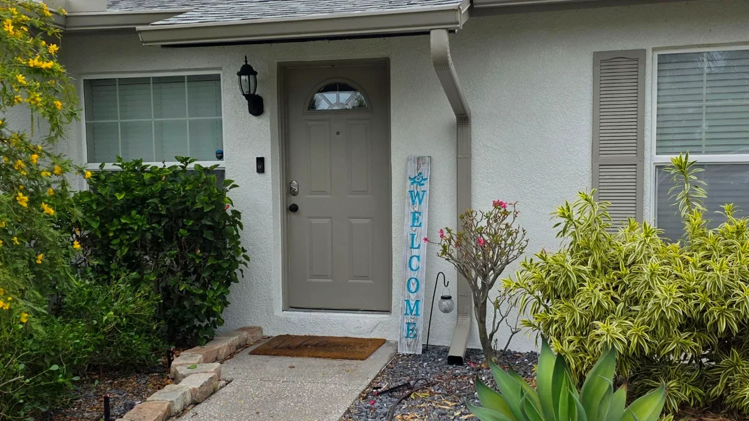 Front entry gutters and downspouts on a North Texas home