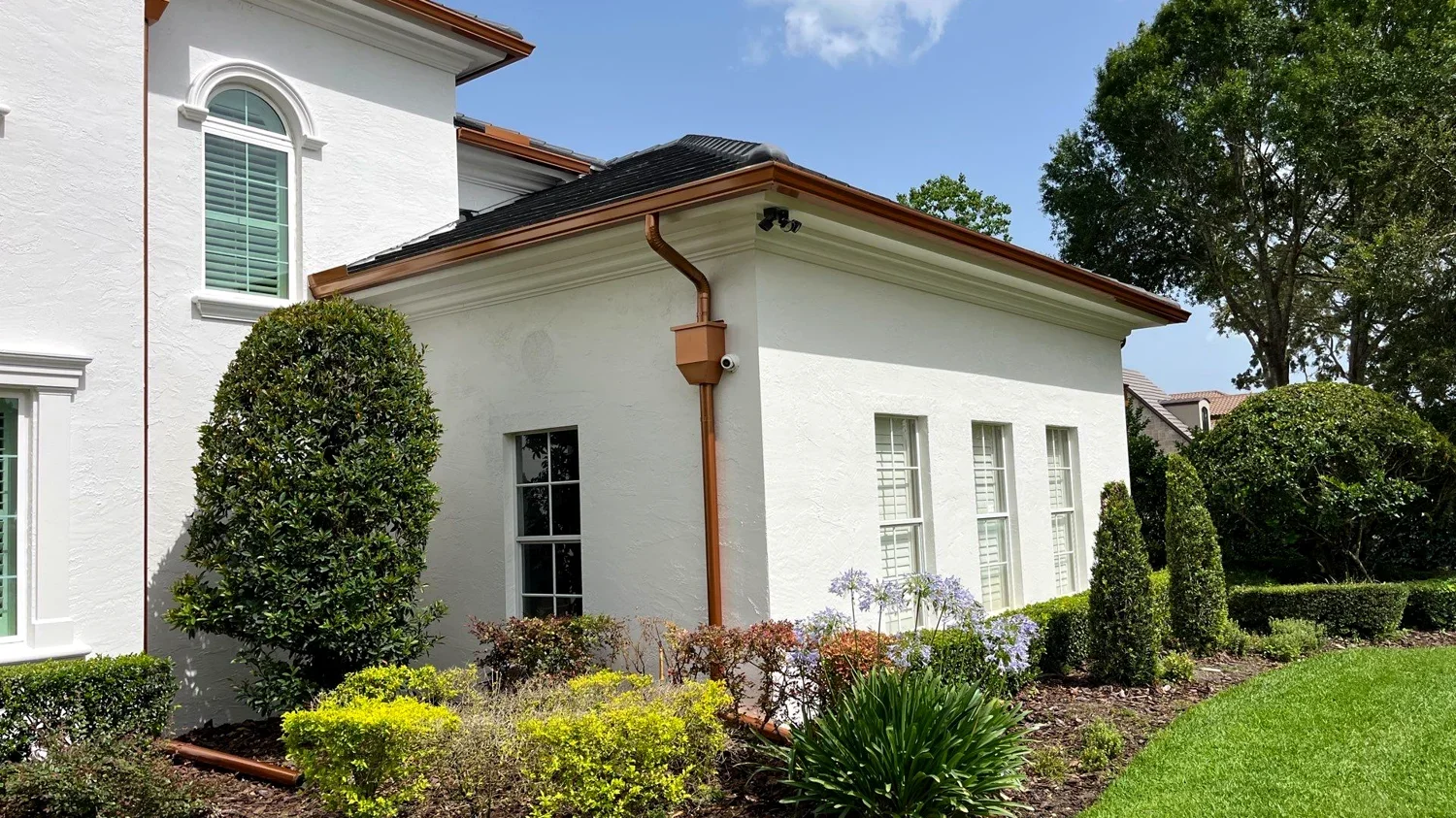 Gutter installation on a screened patio in Garland