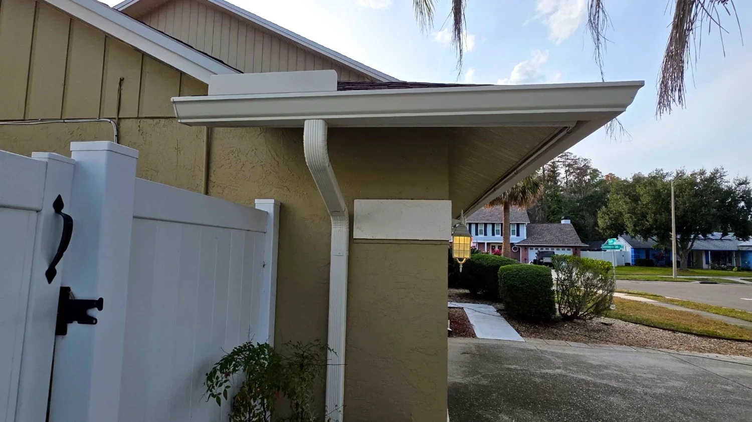 White gutter and downspout installation on a Grapevine home