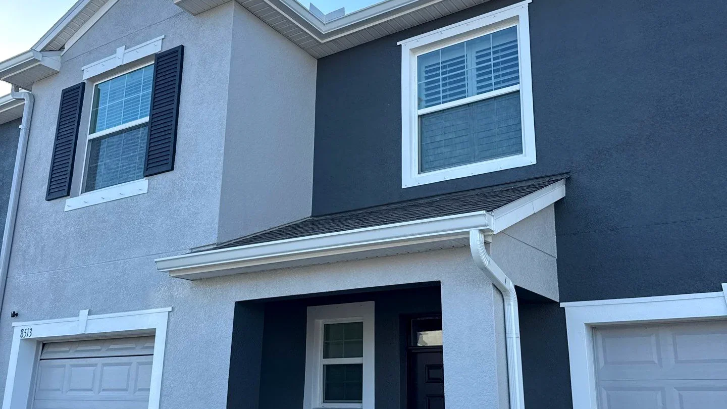 Gutter installation on an Irving townhome