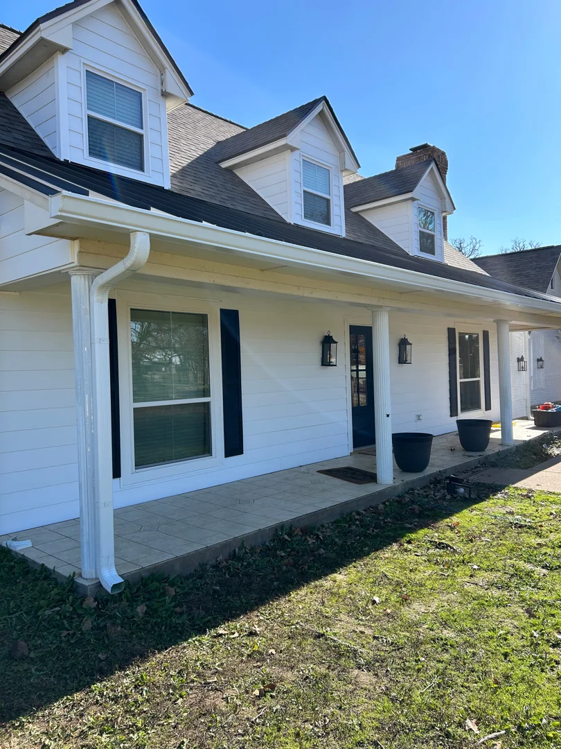 White gutters on a McKinney front porch with columns